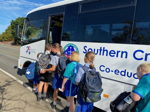 students boarding a school bus