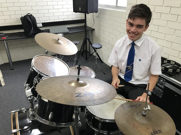 boy playing drums