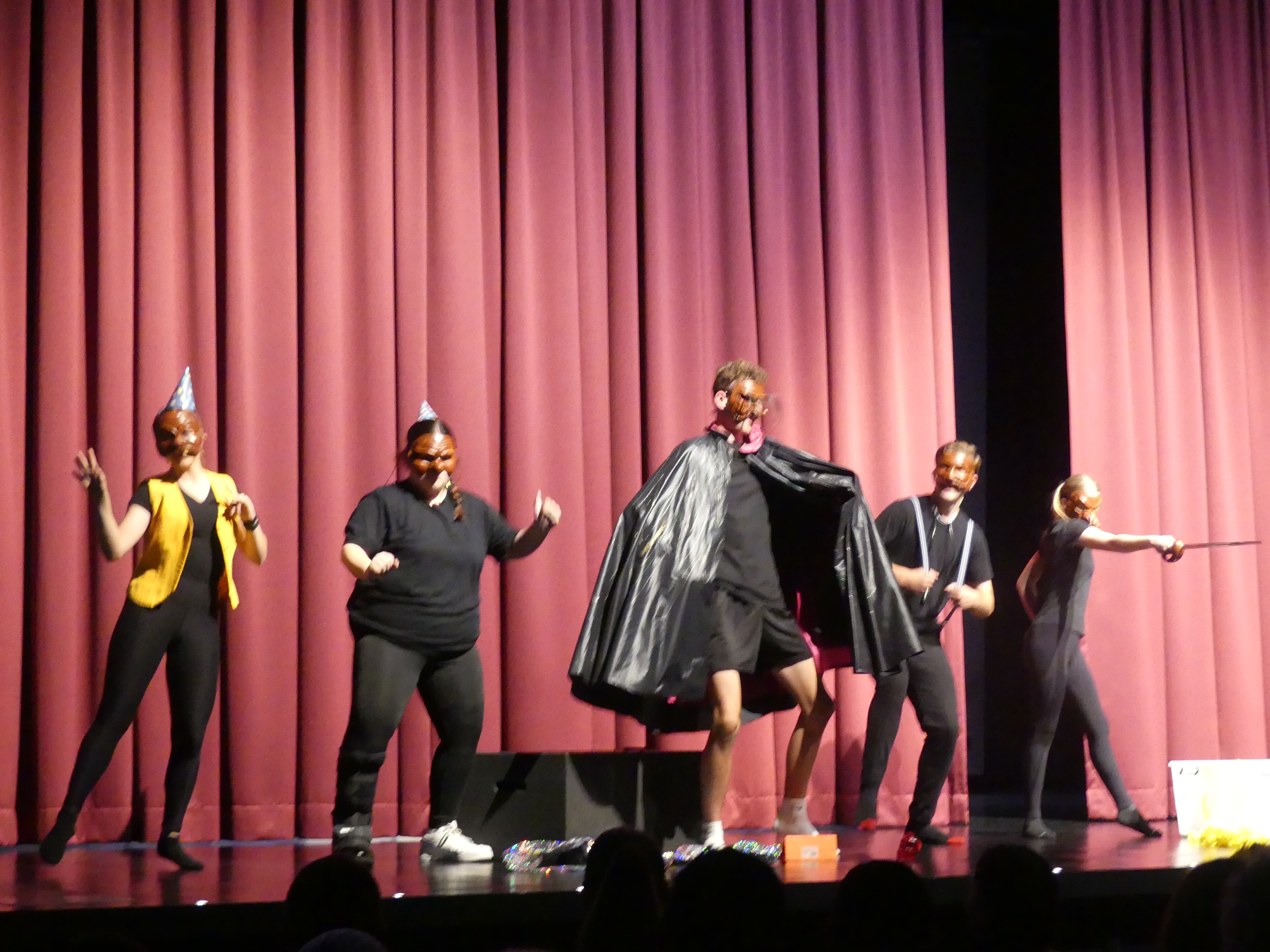 students performing in a theatre production